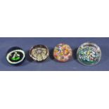 Four good quality Millefiori glass paperweights to include a faceted glass example, a flat top