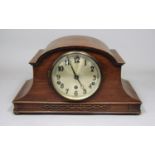 Napoleon hat broad three train musical mantel clock, the silvered dial with Arabic numerals, 42cm