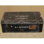 A vintage japanned tin trunk, possibly military related, with painted lettering RF Warren