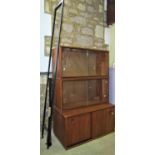 An Avalon modular teak wall unit comprising three cabinets, two metal uprights and six brackets