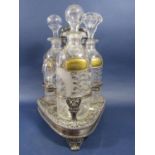 Three good quality cut glass decanters, each etched with fern leaves and with faceted shoulders,