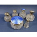 A collection of silver topped dressing bottles to include three guilloche enamel examples (af) and
