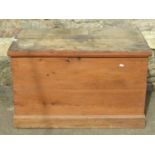 A large 19th century stained pine box with hinged lid and drop side carrying handles, 92cm long x
