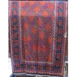 Large old Chalmori kelim with typical colourful geometric design upon a deep red ground, 250 x 150