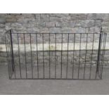 A simple iron work guard with vertical open rails, 162 cm long x 82 cm high