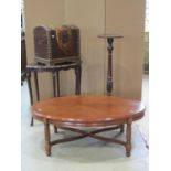 An Edwardian walnut occasional table of oval form with pie crust moulded outline raised on six