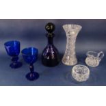 A Bristol Blue lustre decanter together with two further blue glass goblets, three pieces of cut