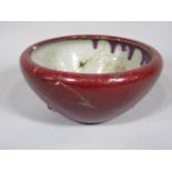 An oriental Sang de Beouf glazed open bowl, 25cm approx diameter (af)