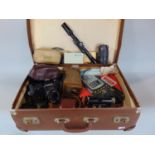 A suitcase containing a miscellaneous collection of vintage camera equipment including a Wirgin Dixa