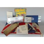 A miscellaneous collection to include a brass cribbage board, union jack, 1977 crown, coin in