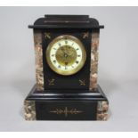 Victorian black slate mantel clock, the enamelled chapter ring framing an open escapement within a