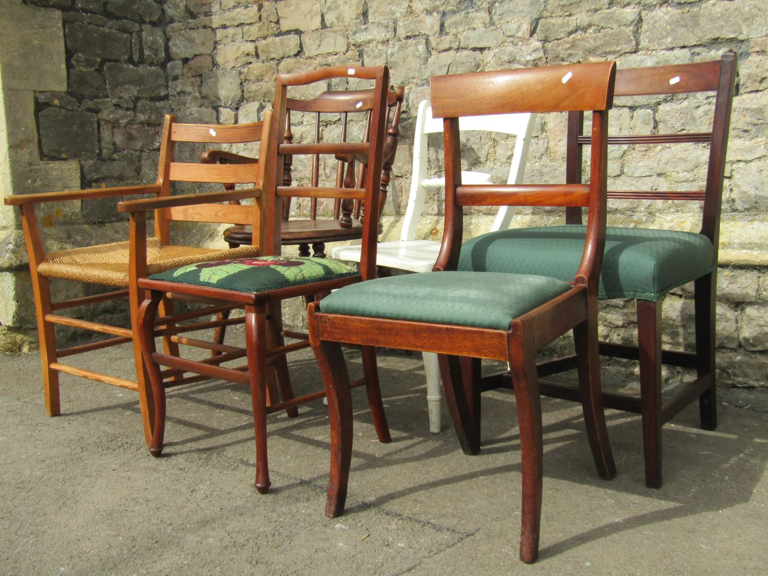 A Swedish stained beechwood stick back elbow chair with circular seat, raised on turned supports ( - Image 2 of 3