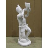 A carved white painted wooden figure of a man in kneeling pose blowing a horn and wearing a simple