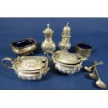 Six silver condiments mainly with fluted detail, together with five spoons, early 20th century mixed
