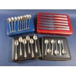 Cased collection of 9 silver teaspoons with golf club and ball handles - various dates, 2.5oz