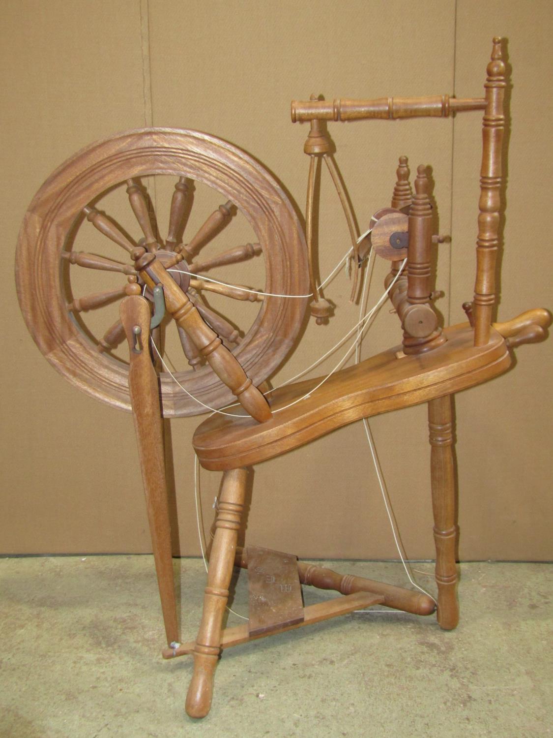 A traditional spinning wheel in beech with turned spindles, stamped underneath G W Cummeber, Watleys - Image 4 of 5