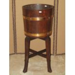 R A Lister & Co Ltd coopered oak and brass banded jardinière and stand, 36cm diameter x 76cm high (