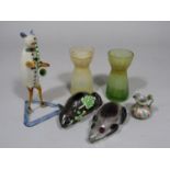 A small ceramic vase in the form of a mouse with applied leaf detail, a glass flask in the form of a