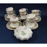 A collection of Shelley Spring Bouquet pattern teawares comprising nine cups, ten saucers and nine