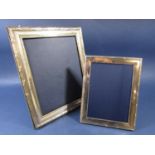 A large silver applied easel picture frame, 31 x 21cm together with a further smaller example (2)