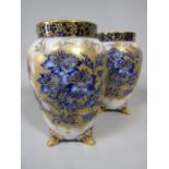 A pair of early 20th century Carltonware vases with painted blue and white and gilded floral