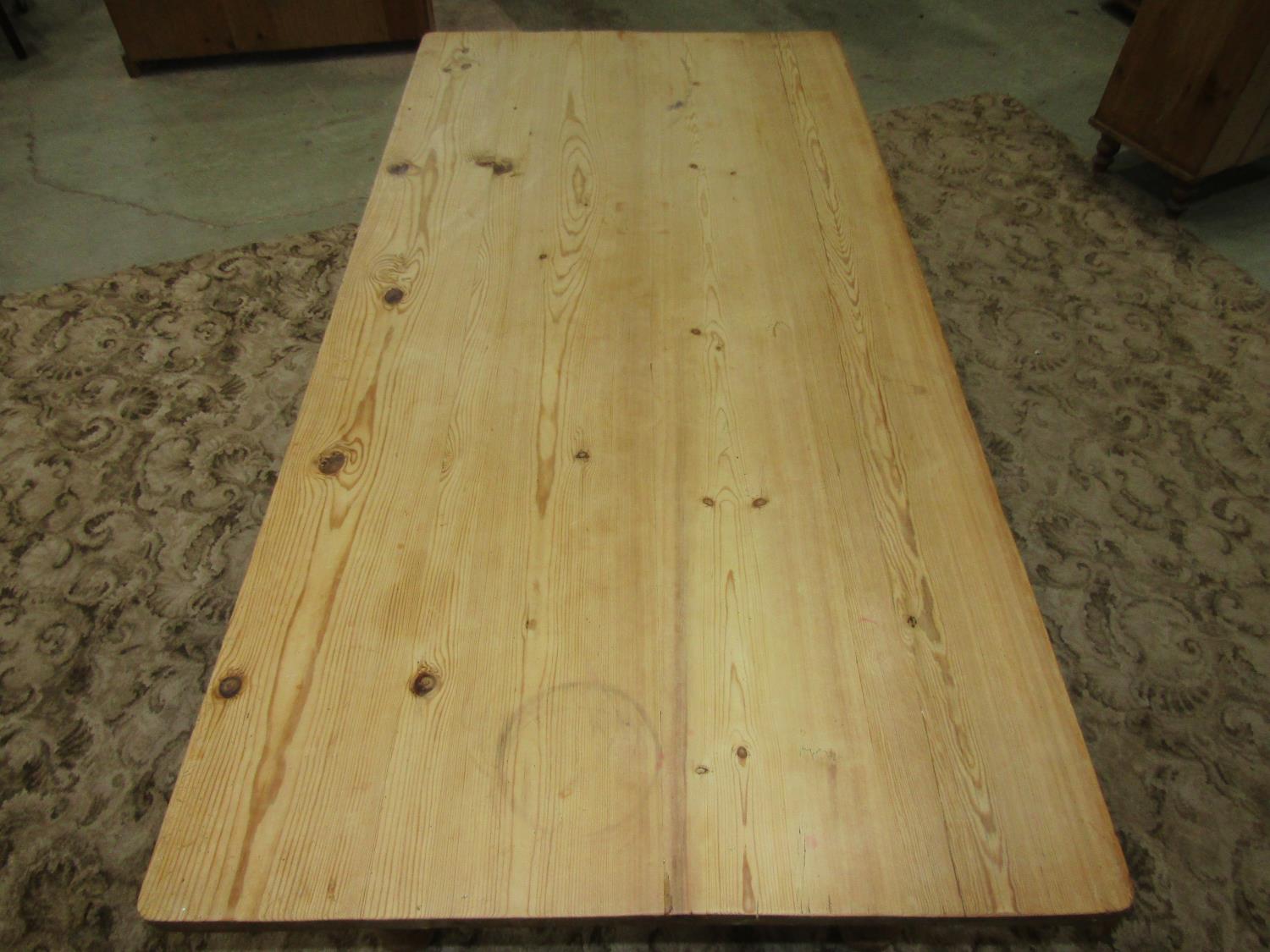 A reclaimed stripped pine farmhouse kitchen table of rectangular form raised on four ring turned and - Image 3 of 5