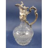 Good quality continental white metal ewer/claret jug, embossed with rococo type foliage over a