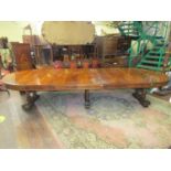 A good quality late Victorian/early Edwardian walnut D end extending dining table, raised on three