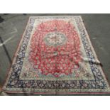 Large Iranian Najafabad Isfahan region carpet, with scrolled blue foliate upon a red and blue