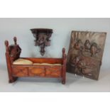 A 19th century carved pine dolls cradle of traditional form with applied detail, 35cm long, small