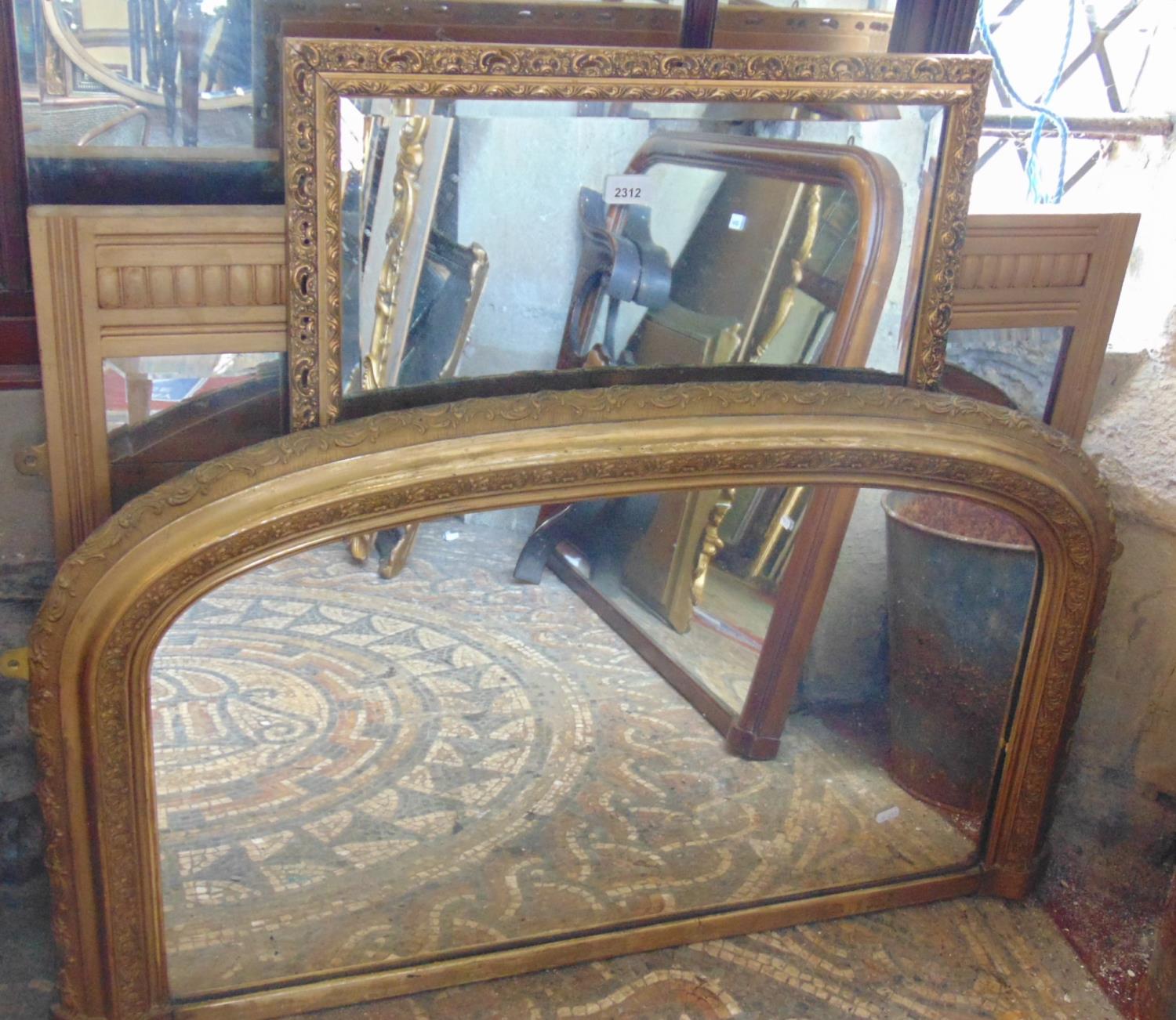 A Victorian overmantle mirror/chimney glass with moulded gilt arched frame with acanthus and further