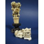 Chinese ivory carving of a floral bouquet upon a carved wooden plinth, 9cm high, together with a