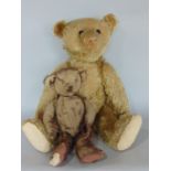 Early 20th century teddy bear by Steiff with pin in ear, blonde mohair fur, boot button eyes,