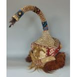 An African Kuba Mukyeem tribal elephant head dress, decorated with shell and beadwork with further