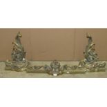 A pair of cast brass chenets and accompanying curb with scrolling acanthus and bunches of grape