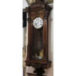 Broad walnut Vienna regulator wall clock, the enamel chapter ring with Roman numerals, subsidiary