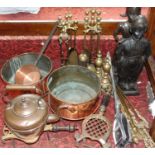 A collection of copper and brass ware including a 19th century copper kettle, two brass kettle