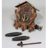 Black Forest type wall hanging cuckoo clock with two novelty weights