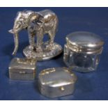 Novelty silver character in the form of a standing elephant, together with a further silver topped