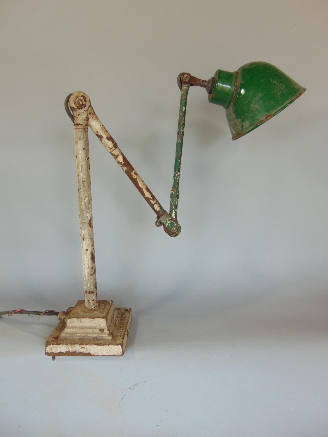A Dugill's Patent Industrial iron work adjustable bench lamp with green enamel shade