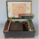 19th century German tin magic lantern, paraffin powered, together with a series of coloured
