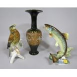 A Hutschenreuther German figure of a leaping trout with water lilies, printed mark to base, 25.5