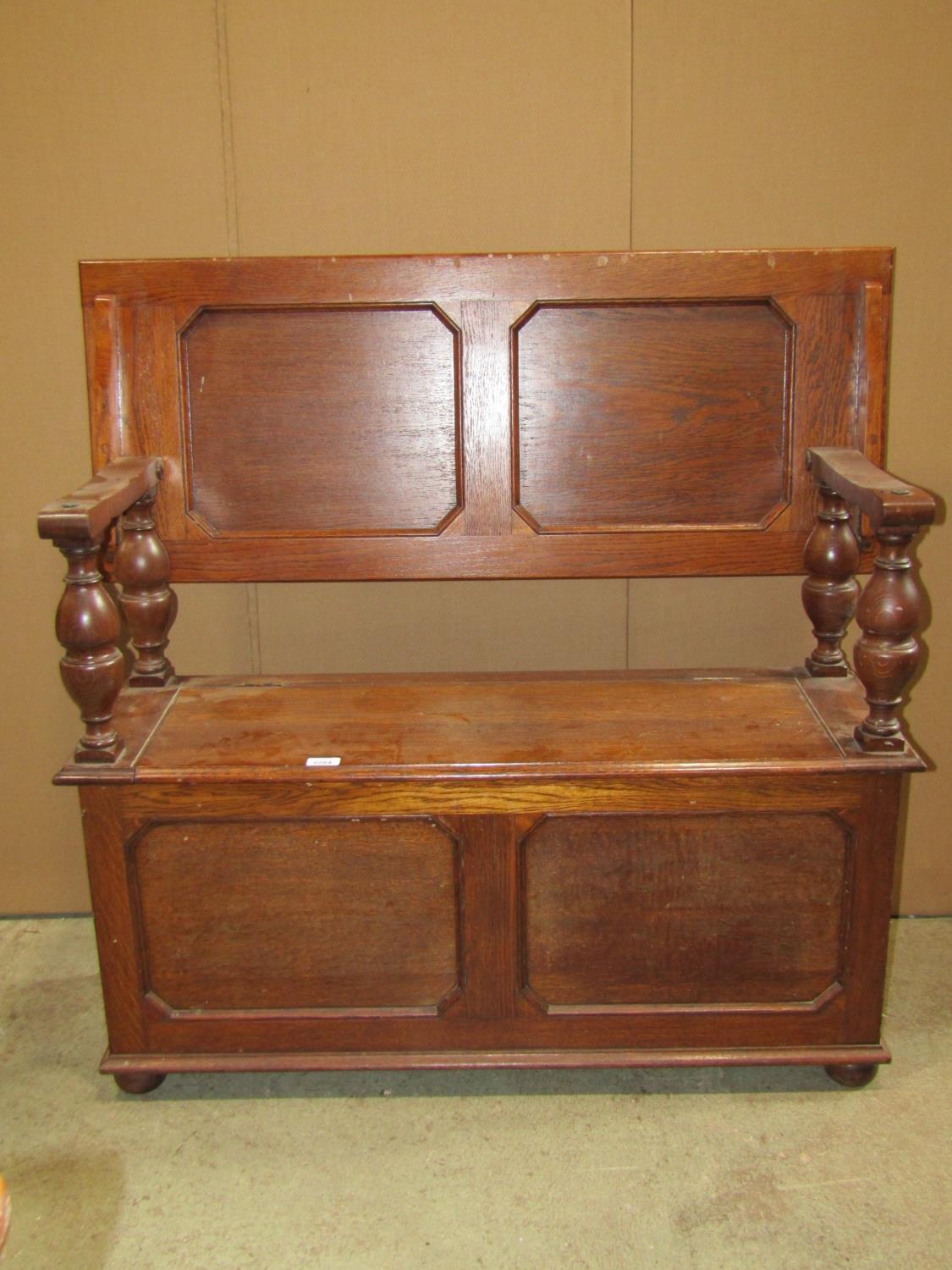 A 1920s narrow oak monks/hall bench, the rectangular sliding top raised on baluster supports over - Image 5 of 5