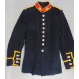 Royal Navy dress uniform jacket with yellow braiding and red collar