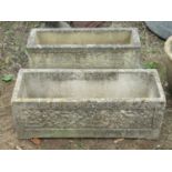 Three reclaimed garden troughs of rectangular form, the larges 75 cm in length, the pair 60 cm