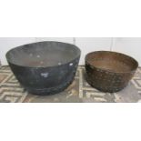 A heavily rivetted antique copper cauldron, 38cm diameter, together with one other larger, 52cm