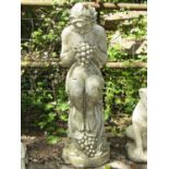 A moulded figure of a nymph in seated pose holding a bunch of grapes, 95 cm in height
