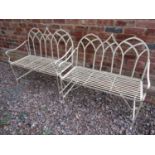 A pair of Regency design garden benches with lattice work backs and painted finish, 103 cm wide