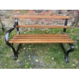 A heavy iron work teak lathe garden bench with single arm (to be placed adjacent to a wall), 120 cm