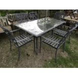 A seven piece cast aluminium terrace set comprising a table with plate glass top, 170 x 100 cm,